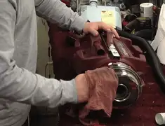Vacuum repair technician cleaning and servicing a vacuum motor in Charleston, SC